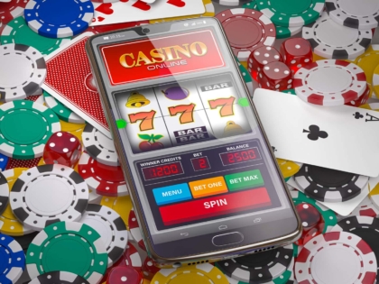 Online casino. Slot machine on smartphone screen, dice, casino chips and cards. 3d illustration