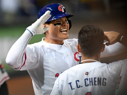 TAICHUNG, TAIWAN - MARCH 10: Yu Chang #18 of Chinese Taipei hits a 2 run homerun to tie the game at the bottom of the 6th inning during the World Baseball Classic Pool A game between Italy and Chinese Taipei at Taichung Intercontinental Baseball Stadium on March 10, 2023 in Taichung, Taiwan. (Photo by Gene Wang/Getty Images)